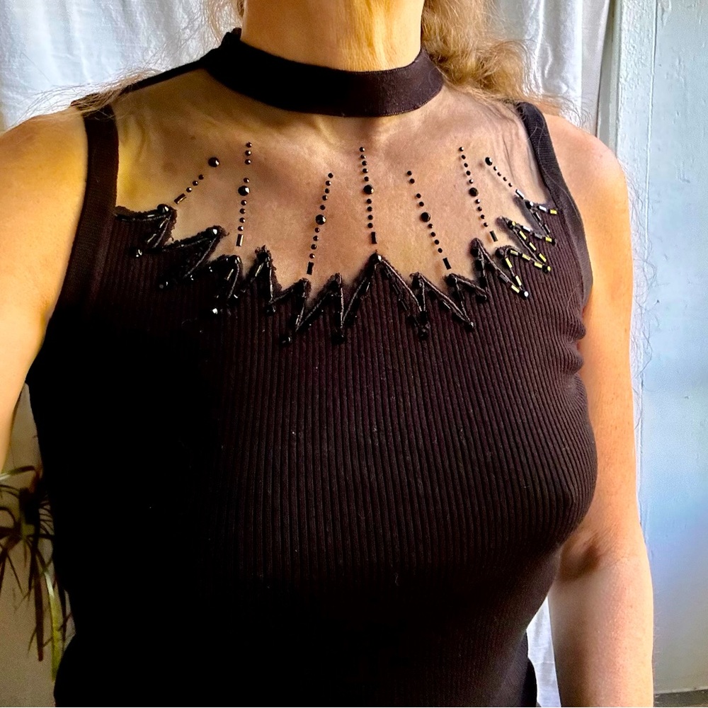 Black knit top with mesh yoke